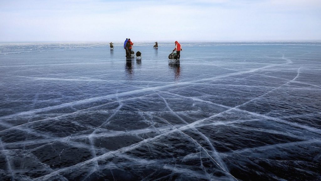A group of people ice fishing 