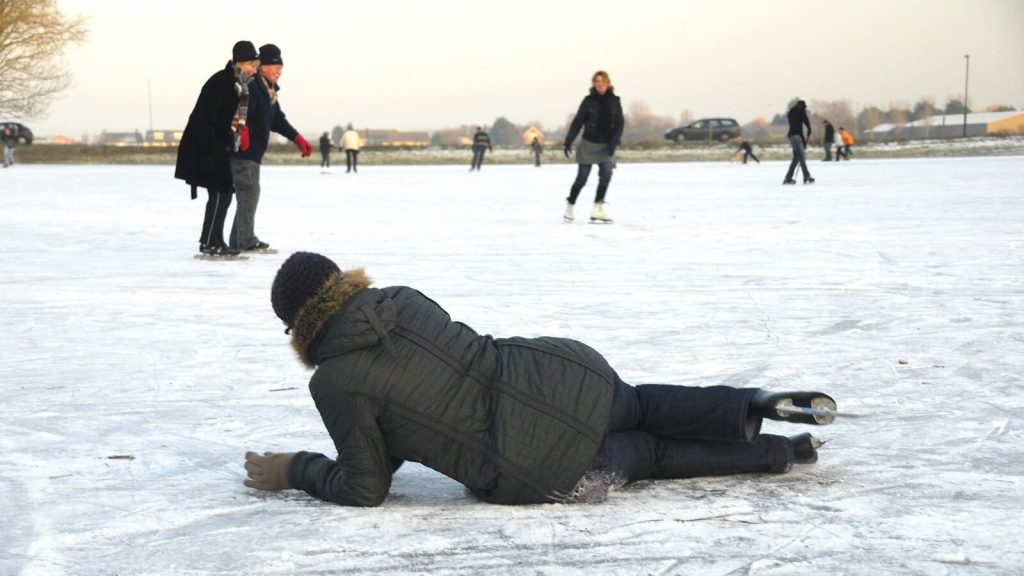 A photo of a person that fell while ice skating