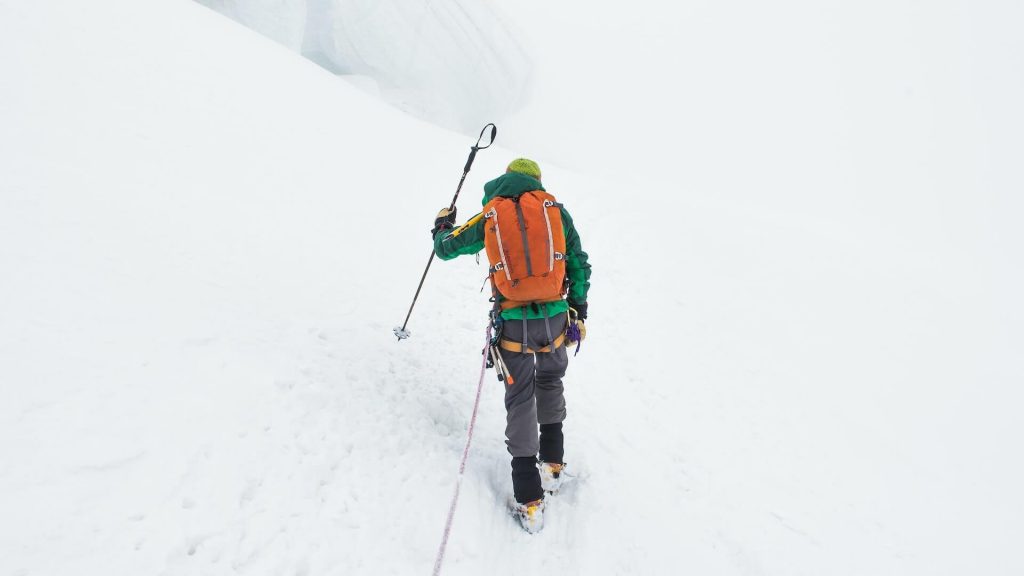 A climber on a snow-covered mountain